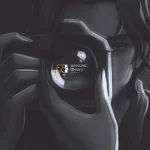 A man holding a camera towards the screen. The logo of Persona Theory games can be seen in the camera's lense.